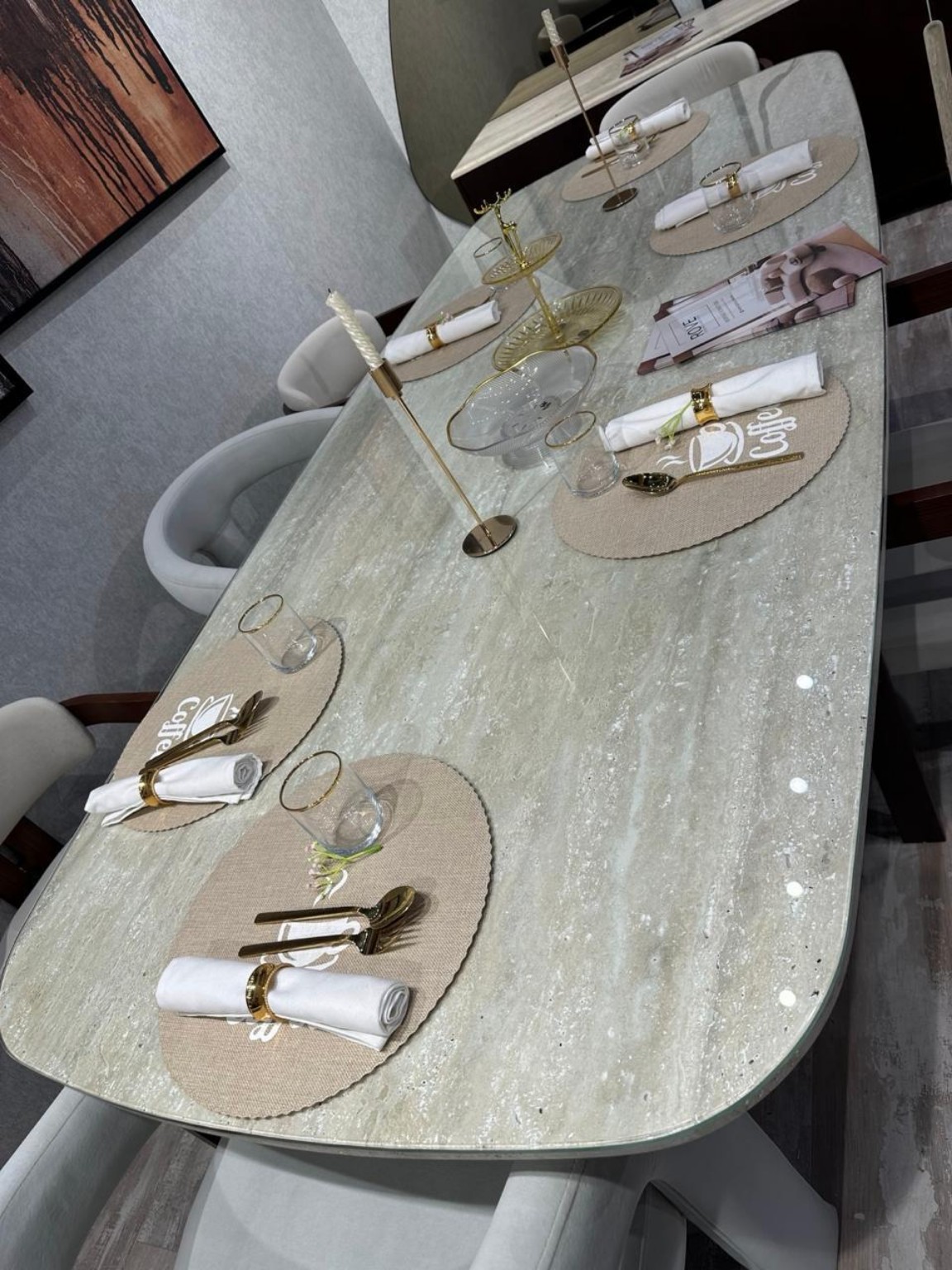 Finished stone dining table with a complete top and seating