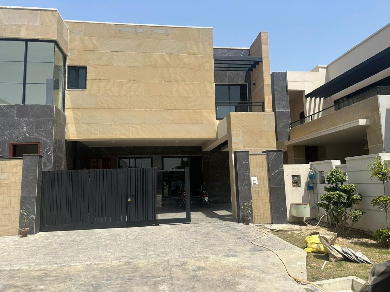 Residential facade with light natural stone cladding