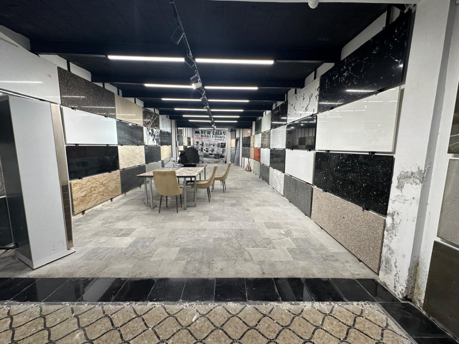 New Eman showroom with stone panels and consultation table