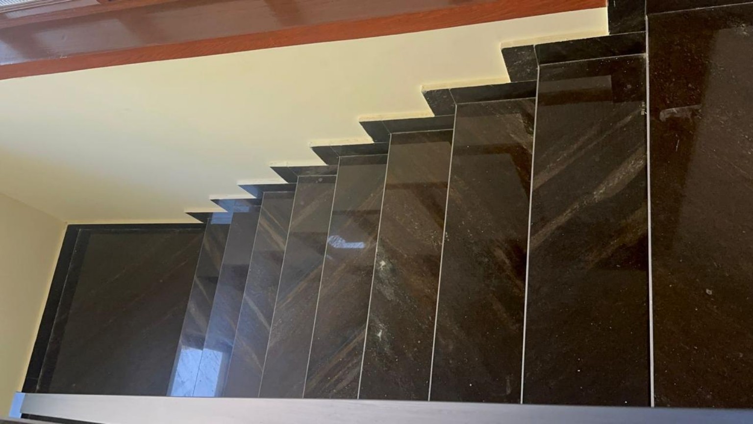 Dark stone staircase viewed from above