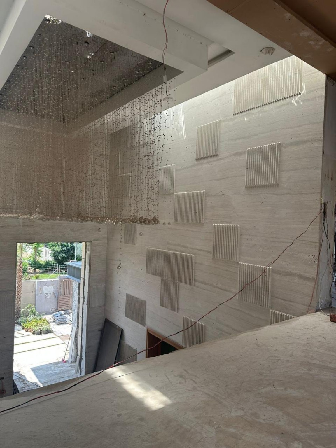 Interior natural stone wall detail in progress