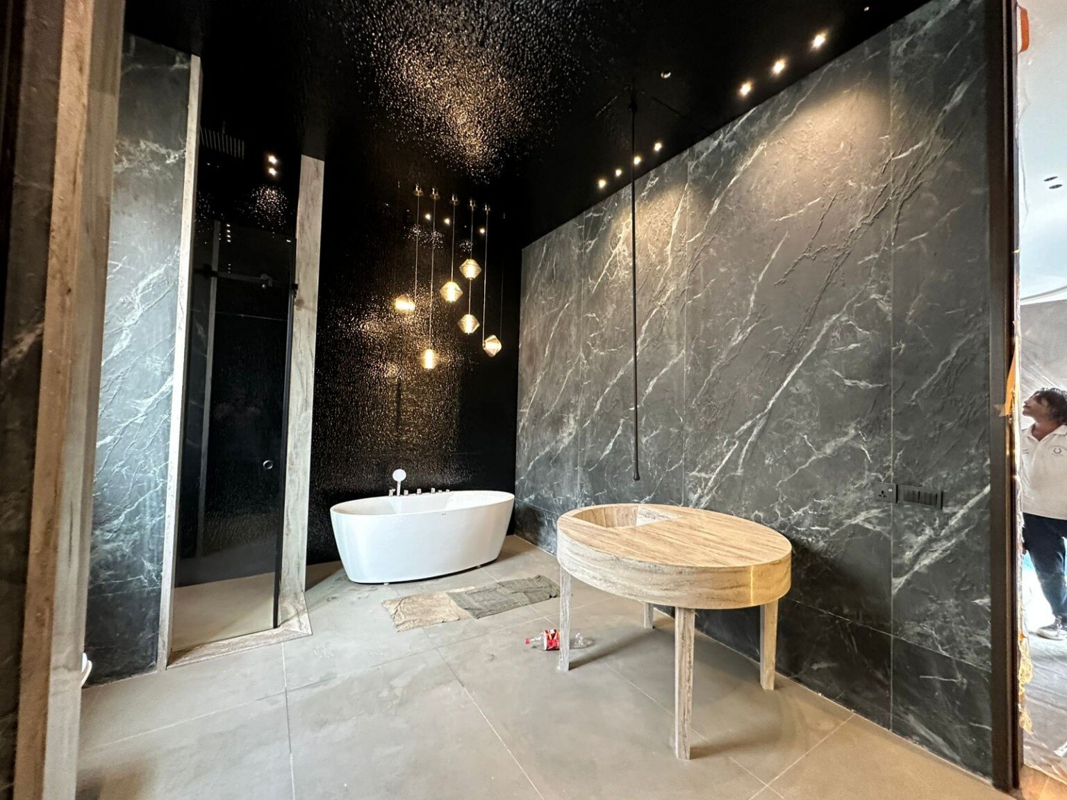 Dark stone bathroom completed by New Eman